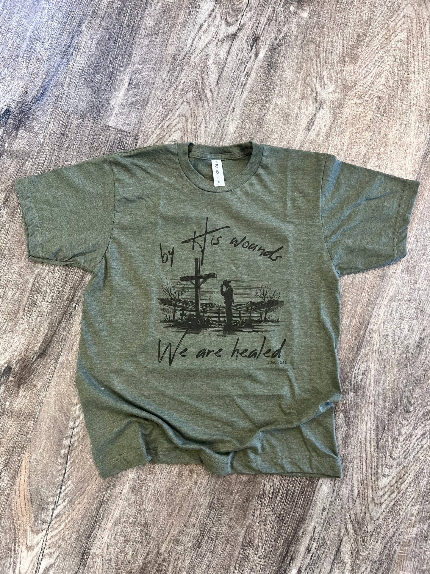 By His Wounds We Are Healed On Heather Military Green Tee