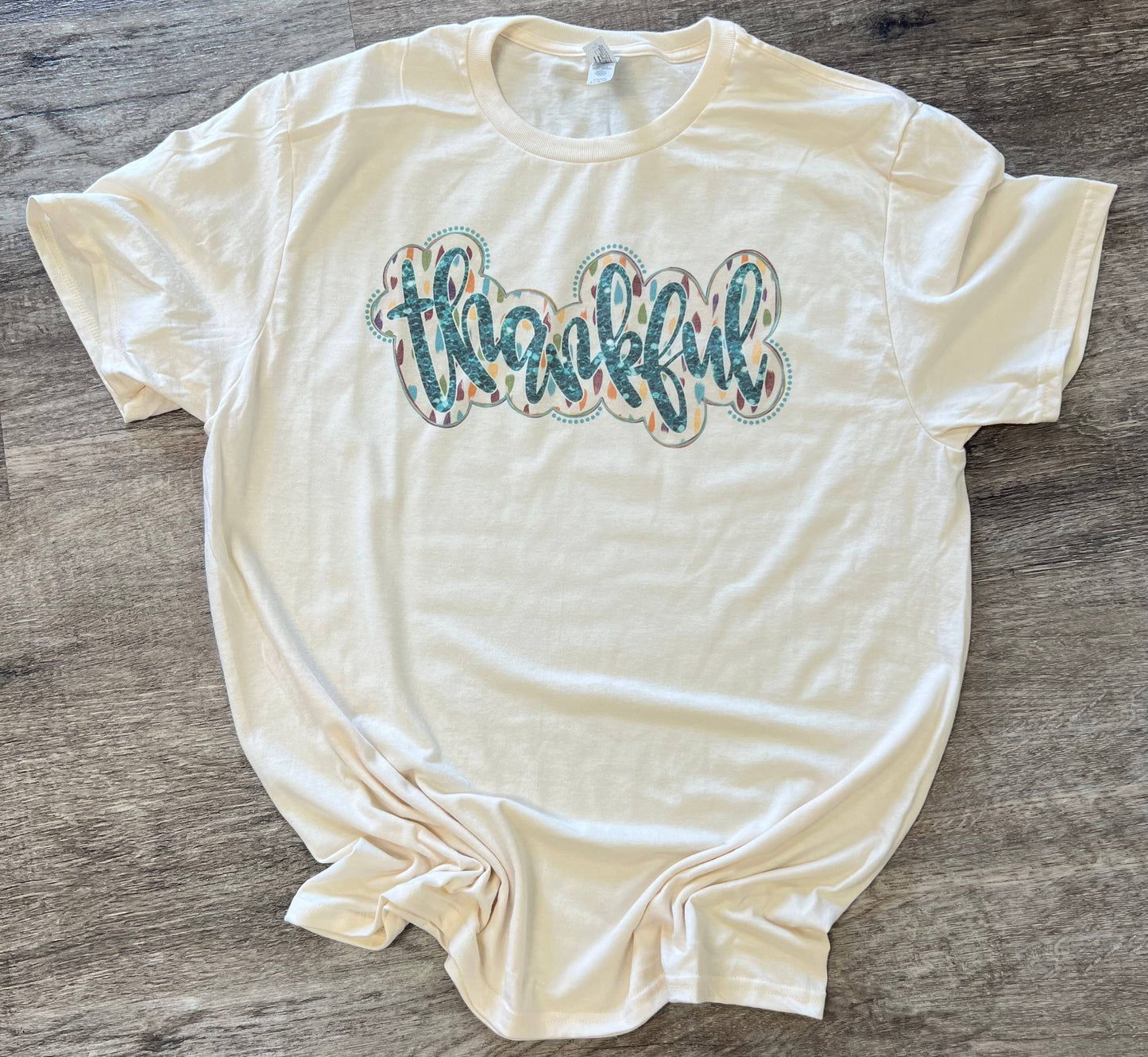 Thankful (Cursive Blue Letters) On Cream Tee