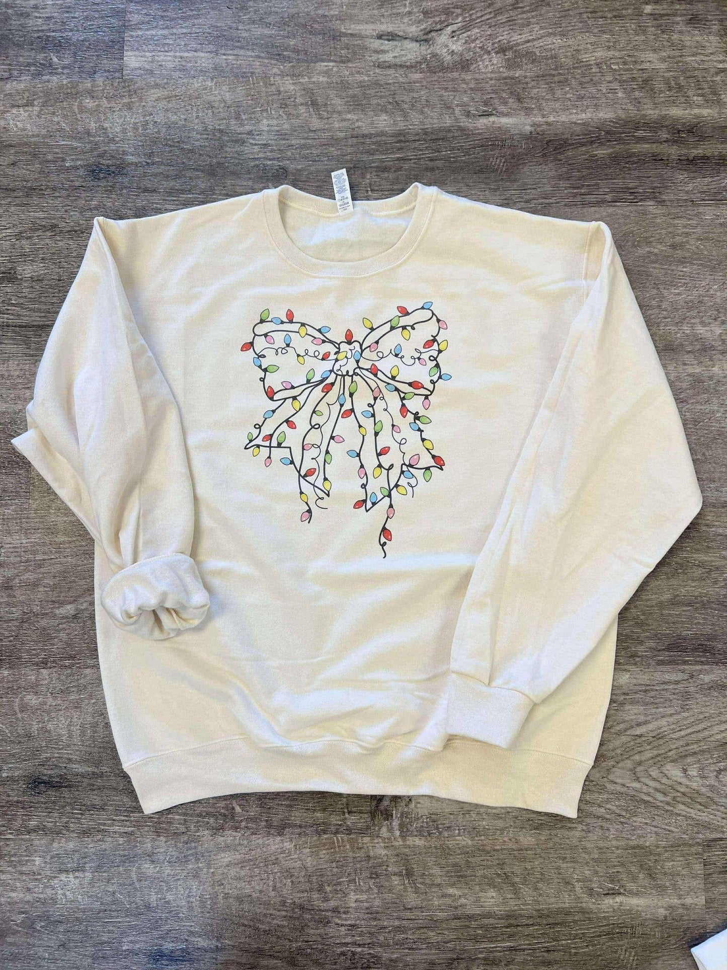 Christmas Tree Lights Bow On Cream Sweatshirt