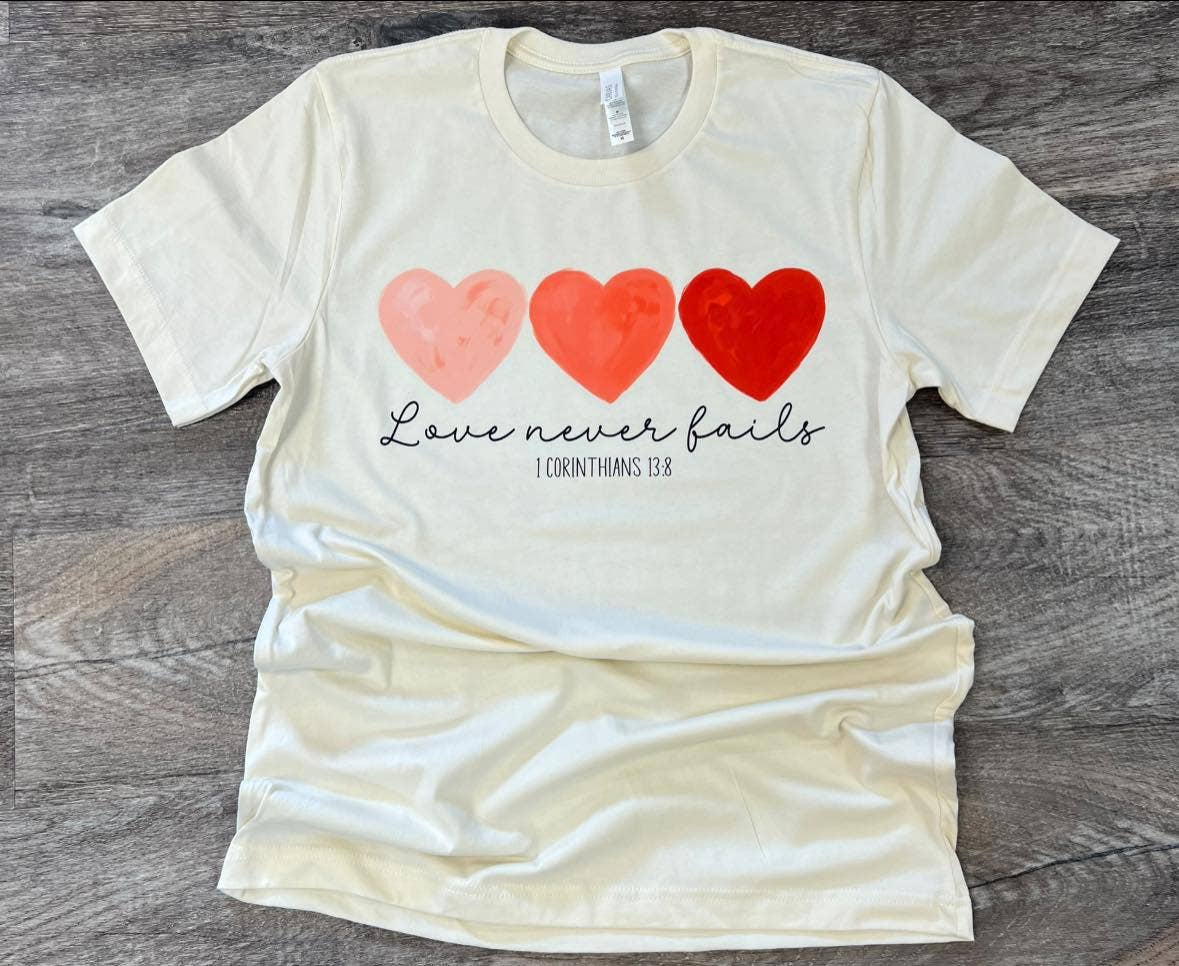 Love Never Fails On Bella+Canvas Natural Tee