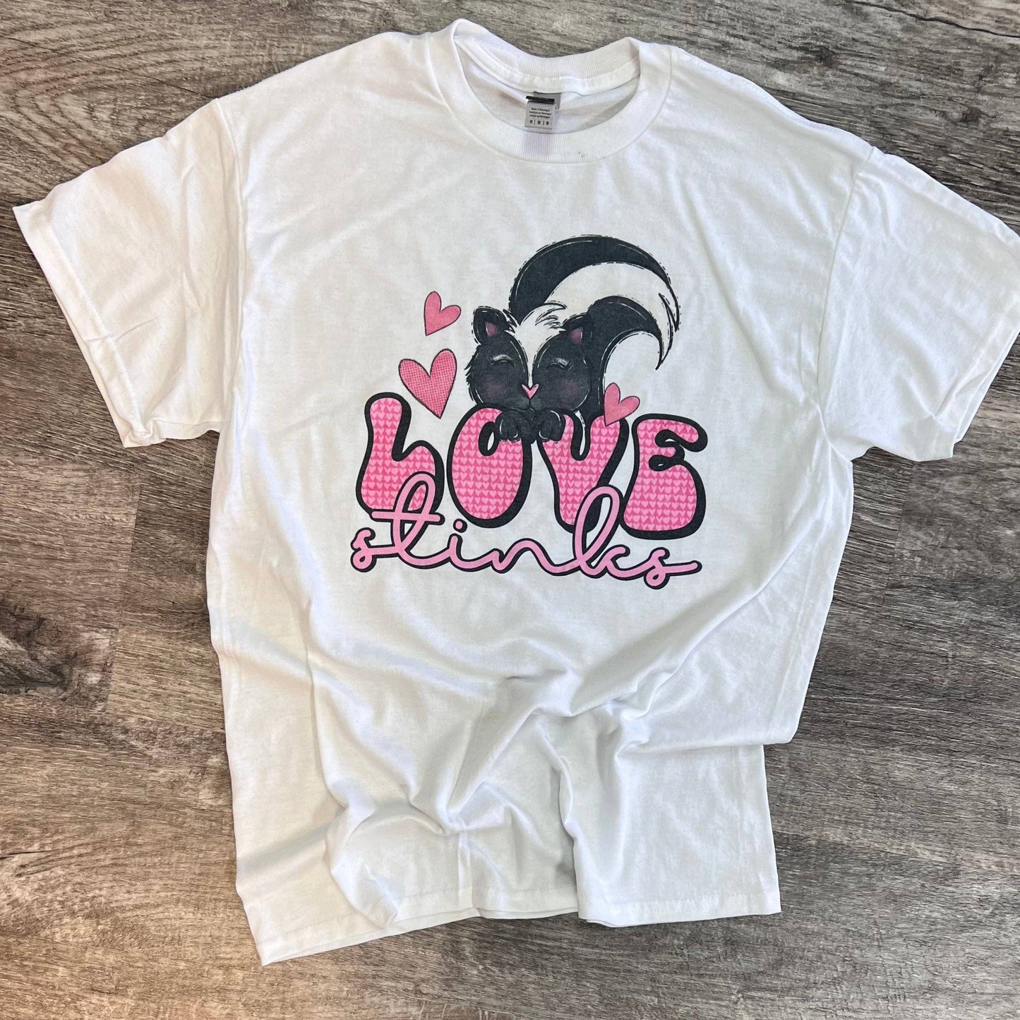 Love Stinks Skunk On White Tee