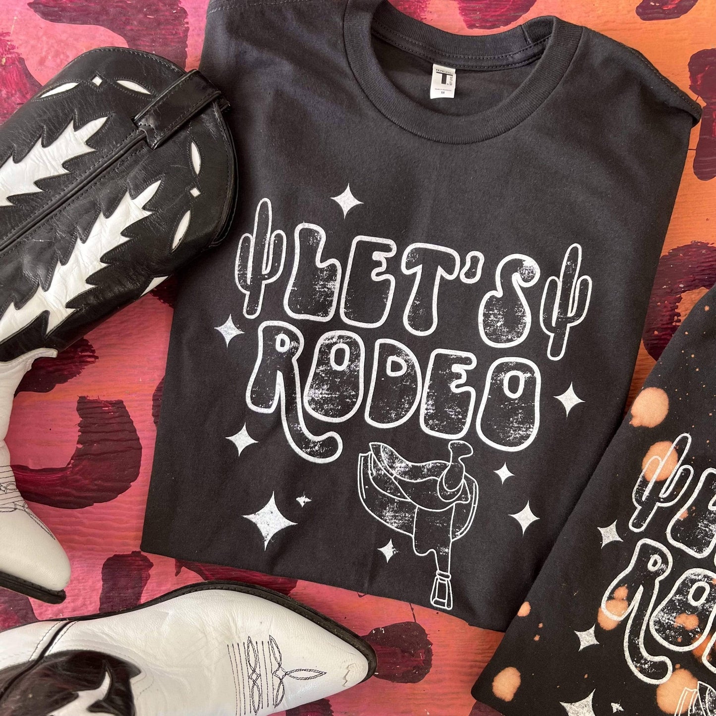 Let's Rodeo with Stars and Saddle - Black Tee